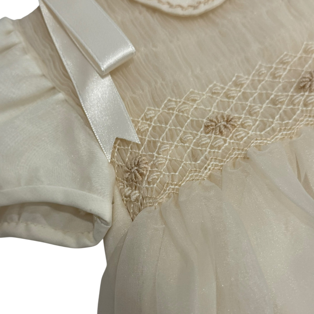 Close-up of delicate tonal embroidery on Lionel Ivory Boy Romper