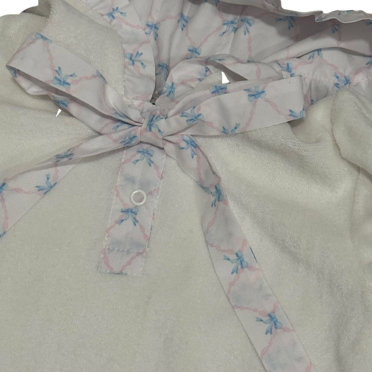 Close-up of light blue bow detailing on Helena Terry Cover-Up