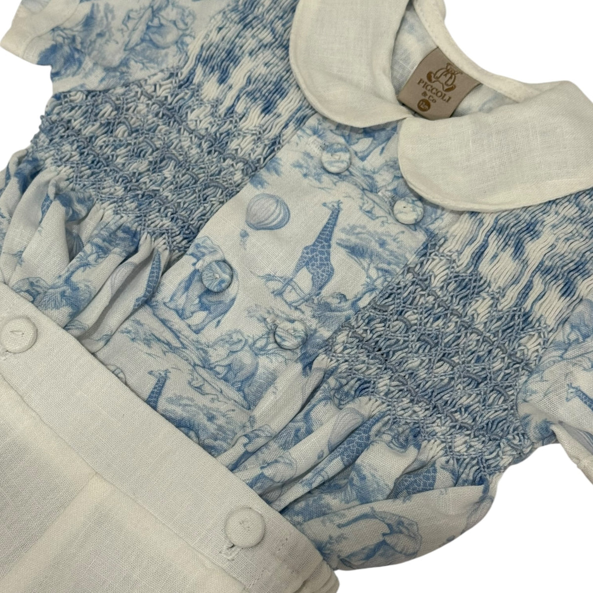 Close-up of rounded ivory collar and blue safari toile detailing on Safari Blue Boy Set