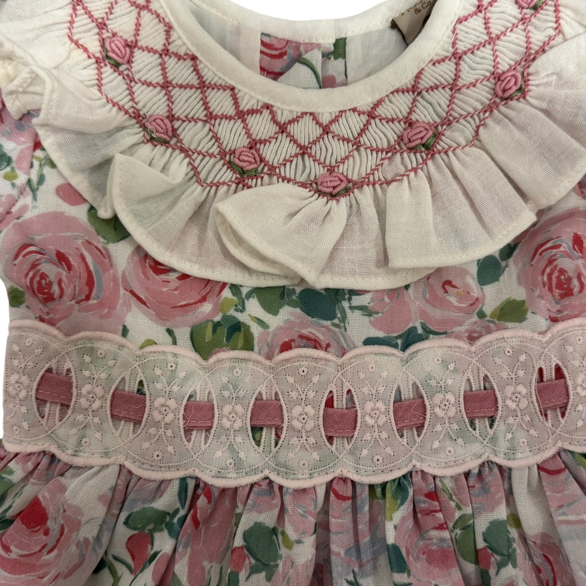 Close-up of handsmocking and floral detailing on Belen Roses Dress
