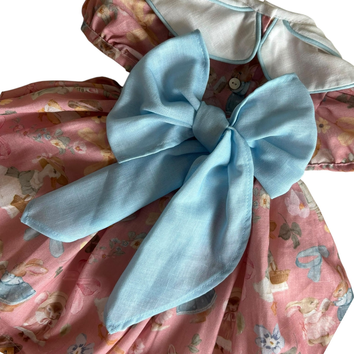 Close-up of oversized blue bow on Karla Whimsy Animals Garden Dress