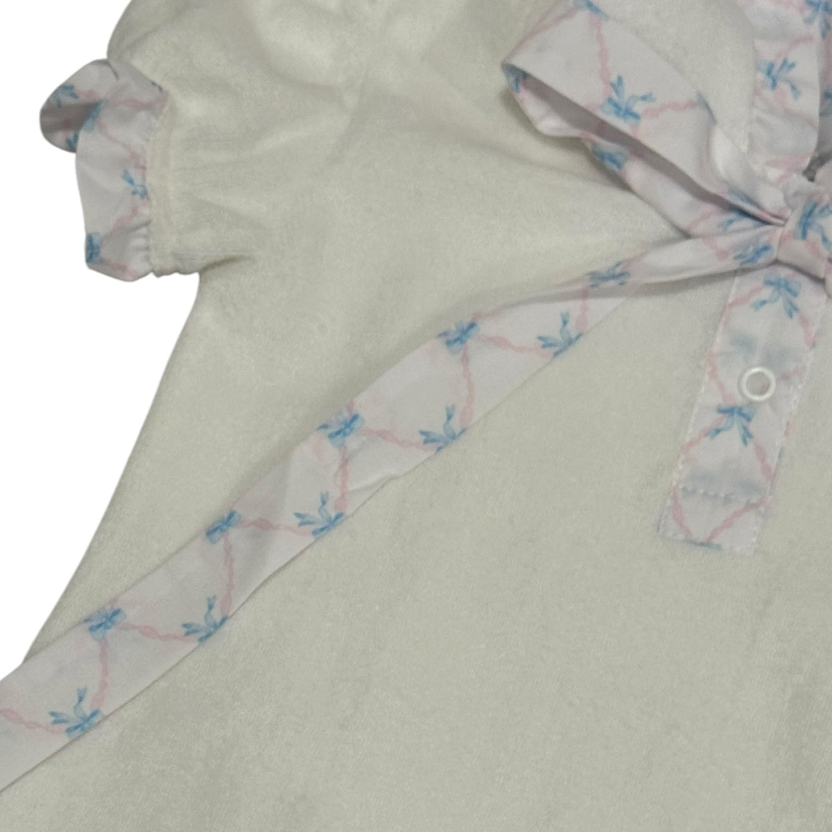 Close-up of ruffled trim and blue bow accents on Helena Bows Cover-Up