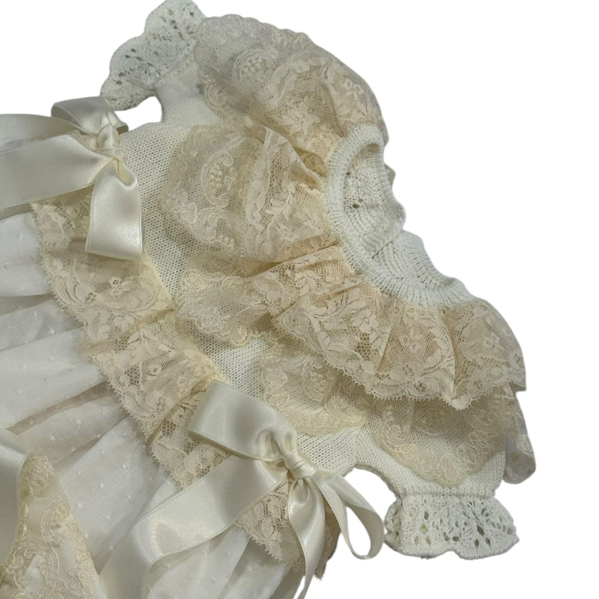 Close-up of knitted bodice and lace detailing on Andrea Ivory Gown