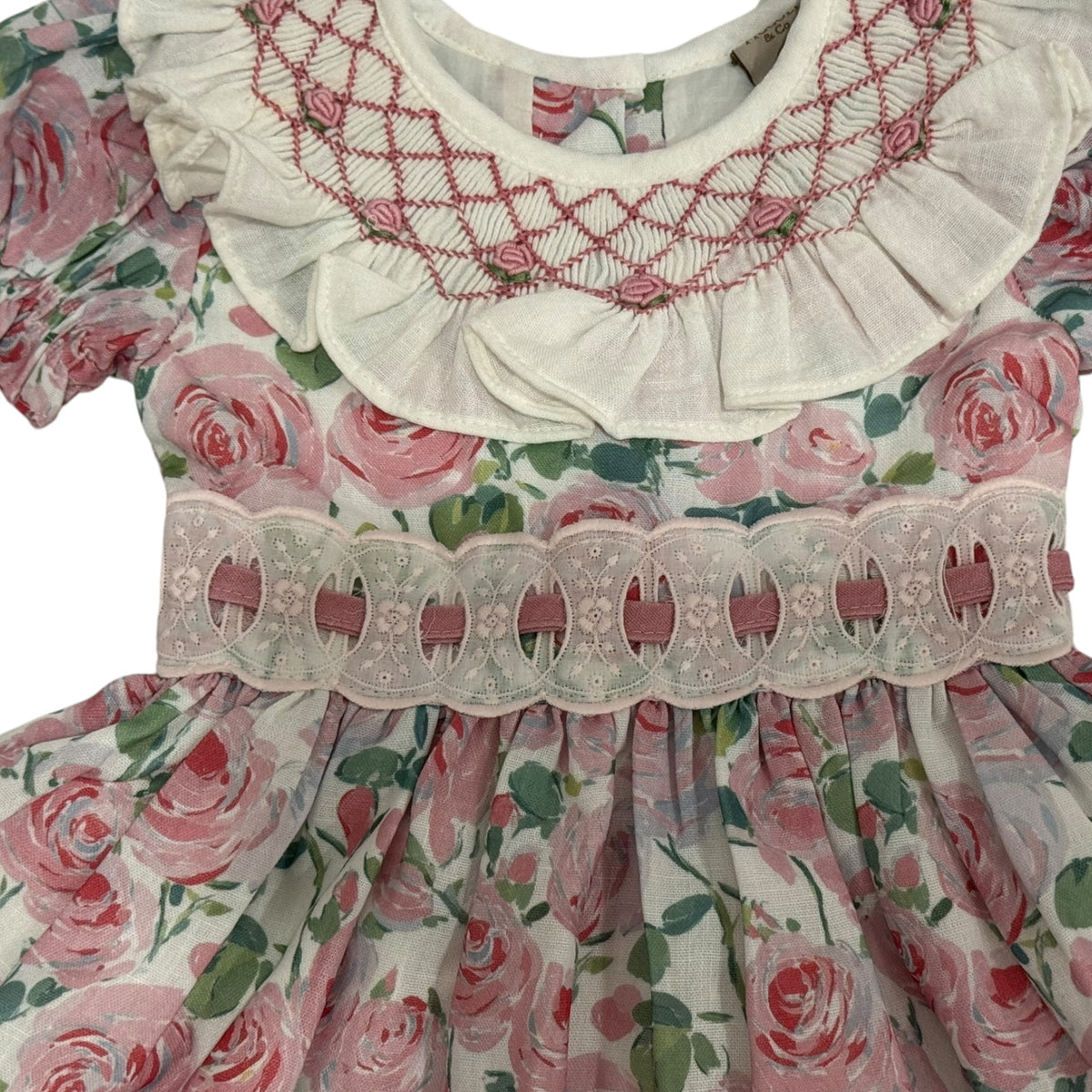 Close-up of handsmocking and floral detailing on Belen Roses Dress