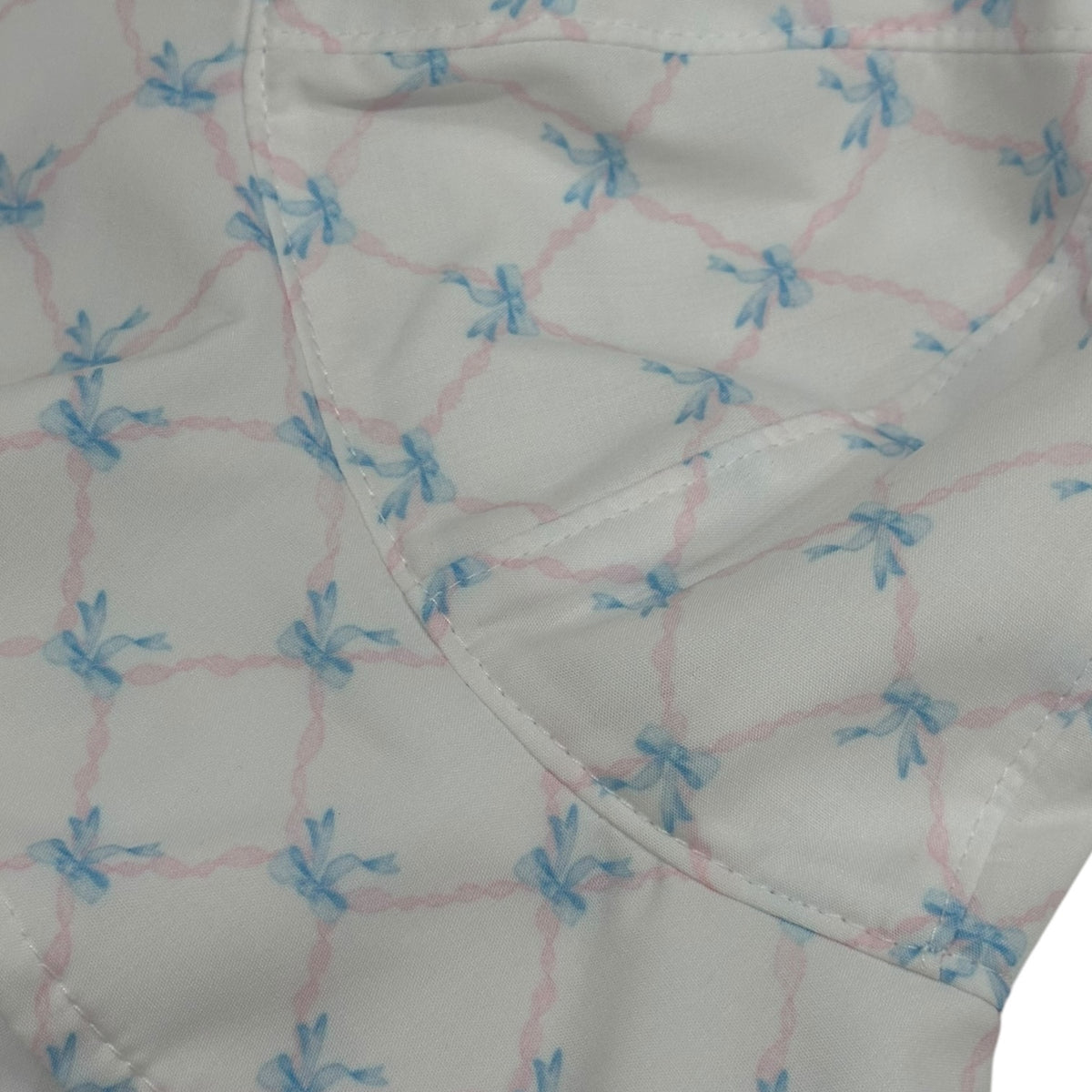 Close-up of blue bow-and-trellis print on Helena Girl Sunny Hat