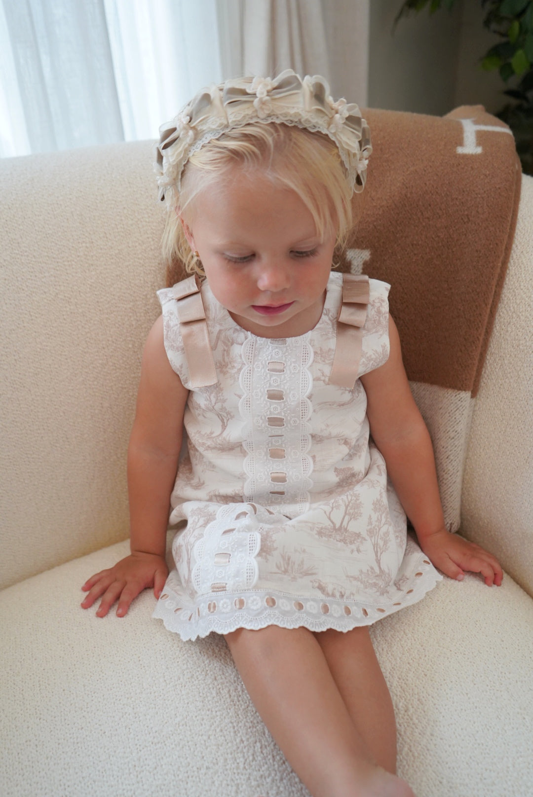 Girl wearing TPWC Taupe Organza Handmade Flowers Headband with coordinating outfit