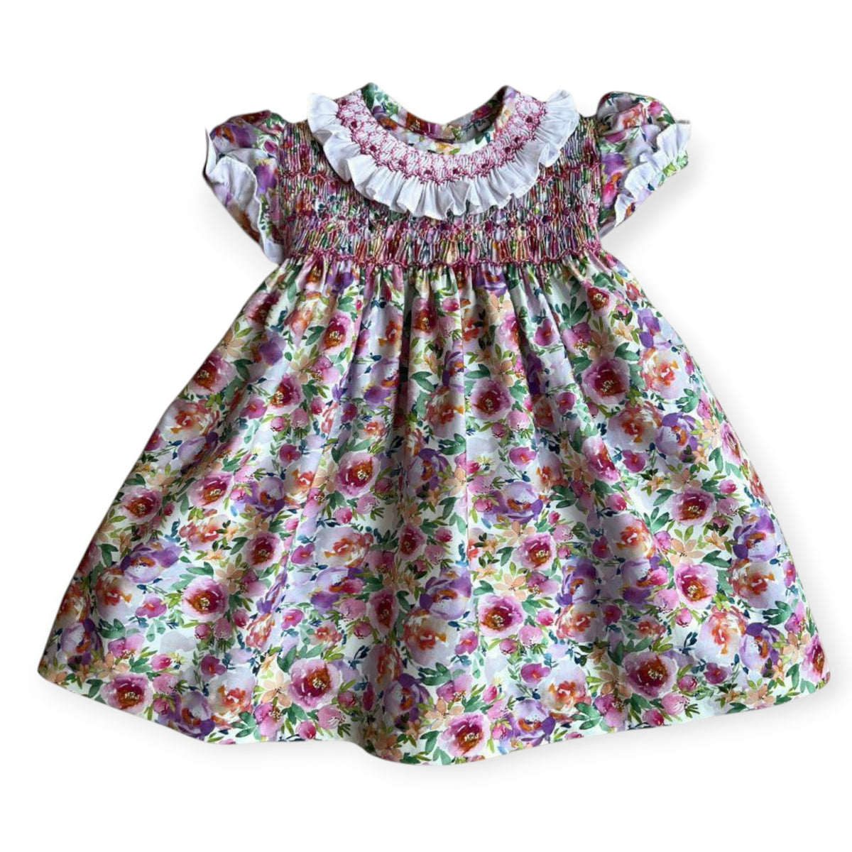 Lizzie Florals Handsmocked Girl Dress with vibrant floral print and smocked bodice