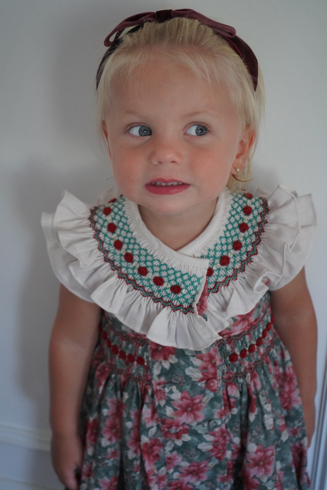 Close-up of girl wearing Christmas Florals outfit with embroidered collar