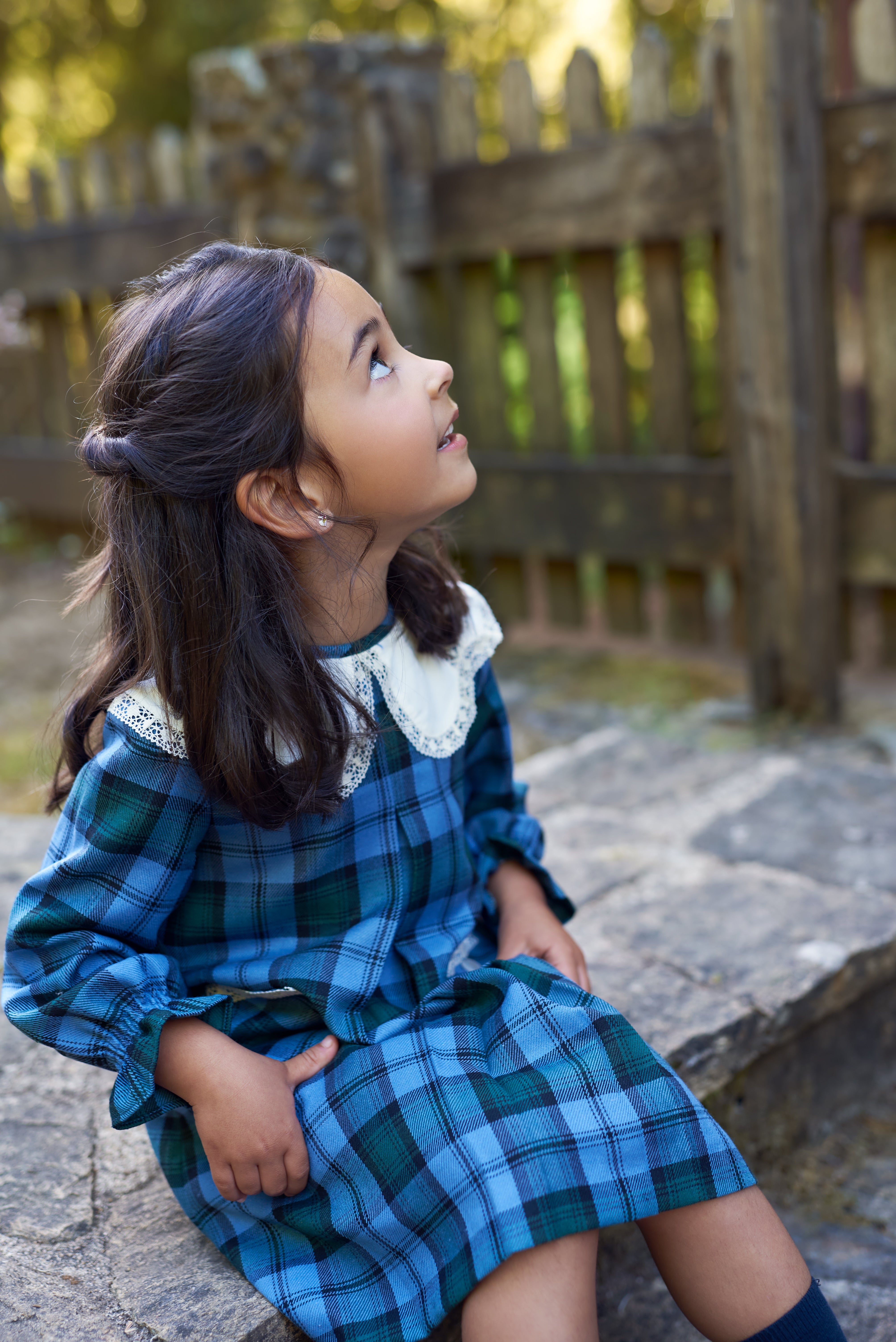 Girl wearing Granada Blue and Green Checkered Dress