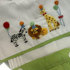Close-up of French knot safari animal embroidery on Party Animals Green shirt