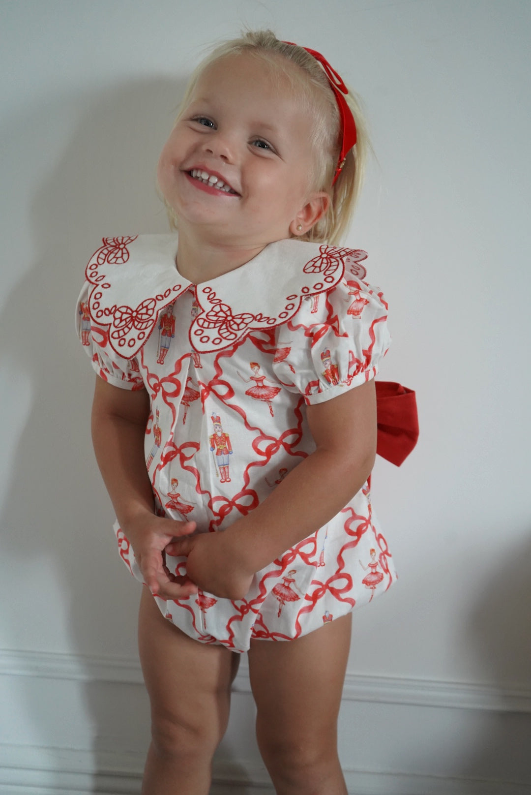 Girl wearing Nutcracker Red Embroidered Collar Bubble 2