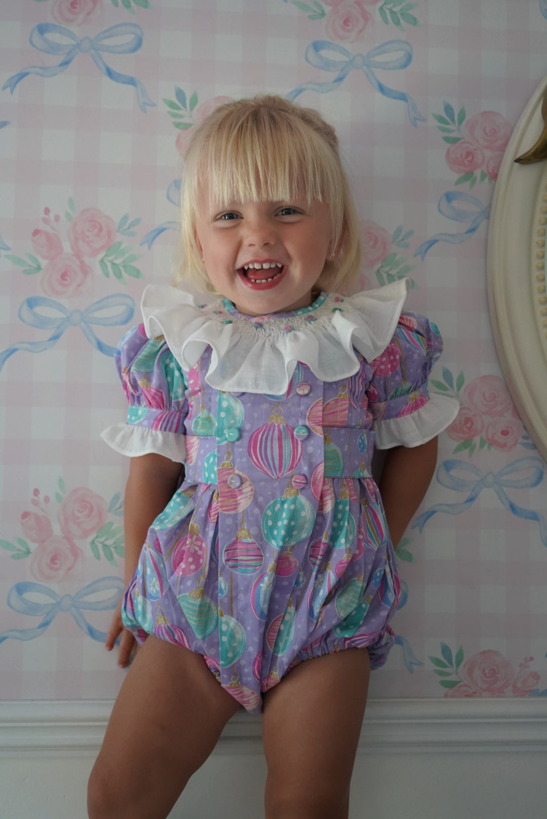 Girl wearing Gigi Ornaments Pastels Handsmocked Romper
