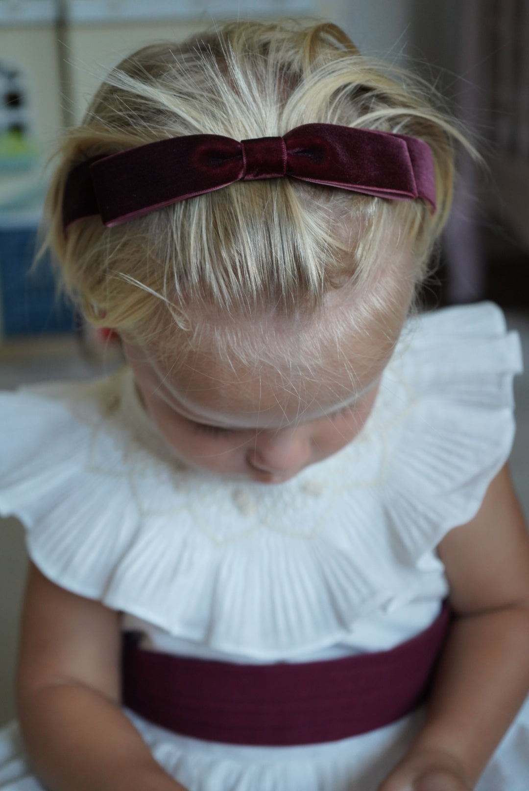 Close-up of smocked collar detailing on TPWC Flower Girl Dress