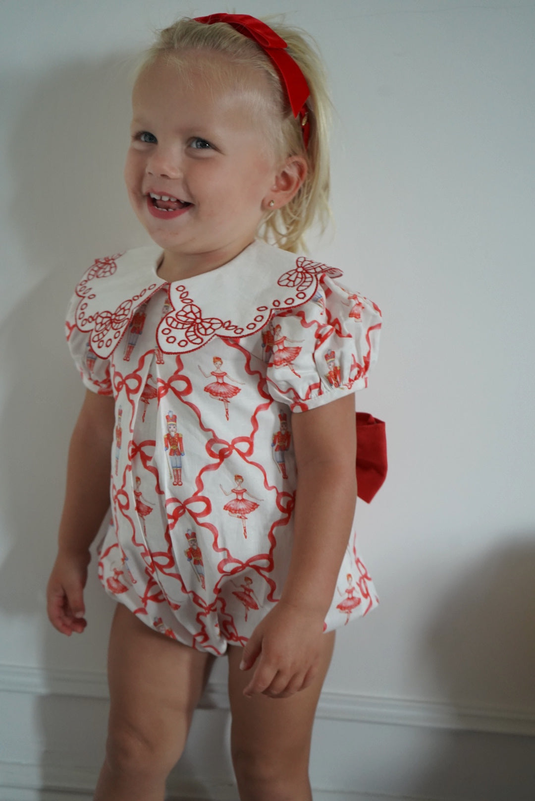 Girl wearing Nutcracker Red Embroidered Collar Bubble