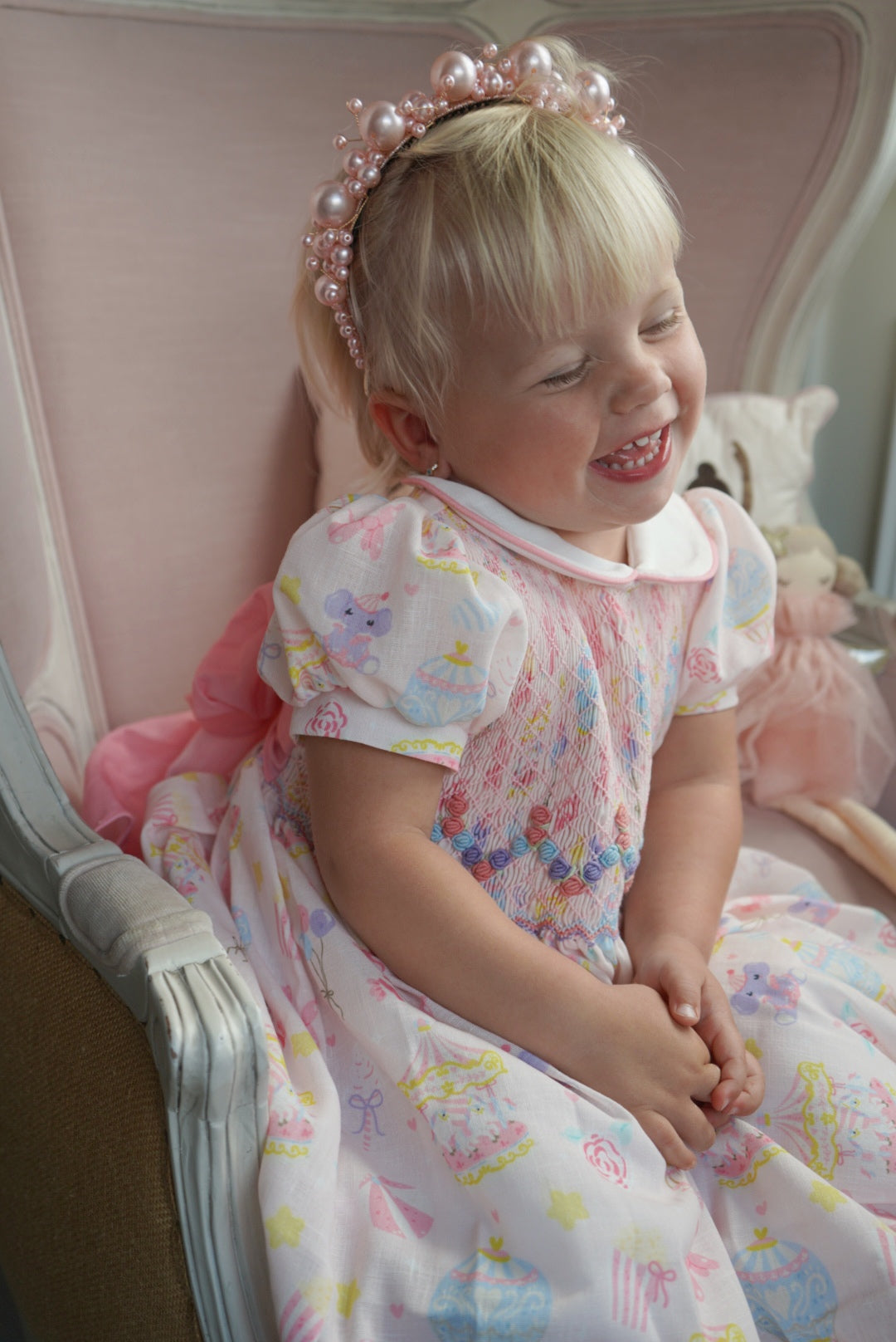 Girl wearing Carnival Carousel Handsmocked Girl Dress